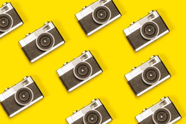 istock Vintage photographic cameras on a yellow background 1401568942