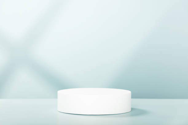 istock Abstract empty white podium with geometric shadows on blue background. Mock up stand for product presentation. 3D Render. Minimal concept 1401571080