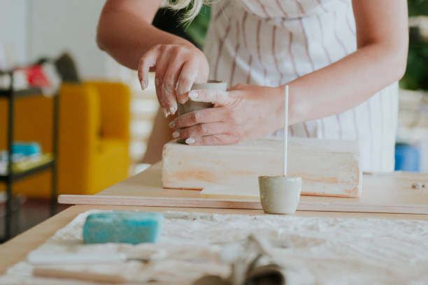 istock Confident woman making pottery in workshop. 1401571439