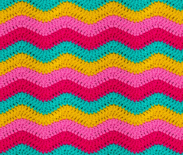 istock Seamless knitted pattern in the form of zigzags is crocheted with bright multi-colored threads. Acrylic baby yarn. 1401571949
