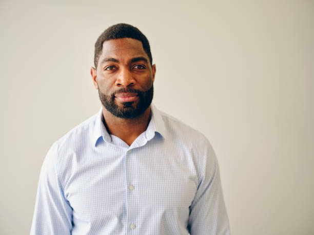 Portrait of a Man A natural light portrait of an African American man. african american man portrait 30s stock pictures, royalty-free photos & images