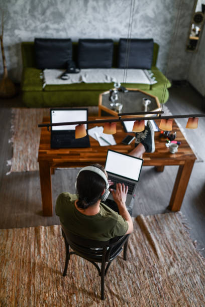 istock High Angle View Of Modern Male Freelancer Completing Work Relaxed At Home 1401575708
