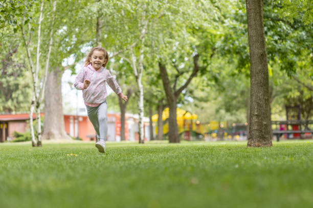 istock Girl running on a grass 1401575757