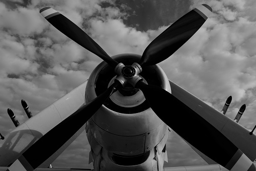 Infrared Black and White Image - Propeller airplane with folded wings