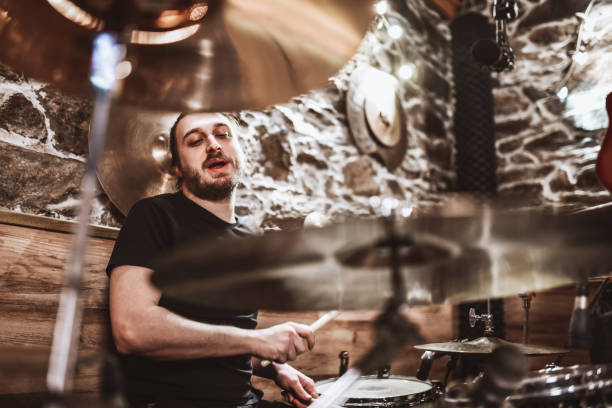 istock Bearded Drummer Completing Great Fills On Drum Kit In Studio 1401577068