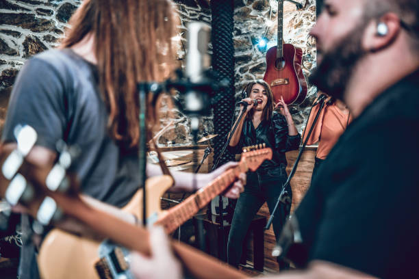 istock Band Playing Well Through Song In Studio 1401577116