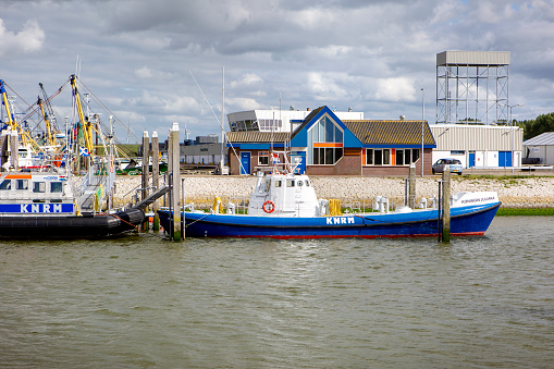 Stellendam, The Netherlands - May 29, 2022: Lifeboats of KNRM at Port of Stellendam, The Netherlands. KNRM, Koninklijke Nederlandse Redding Maatschappij is The Royal Netherlands Sea Rescue Institution. It is a voluntary organization in the Netherlands tasked with saving lives at sea.