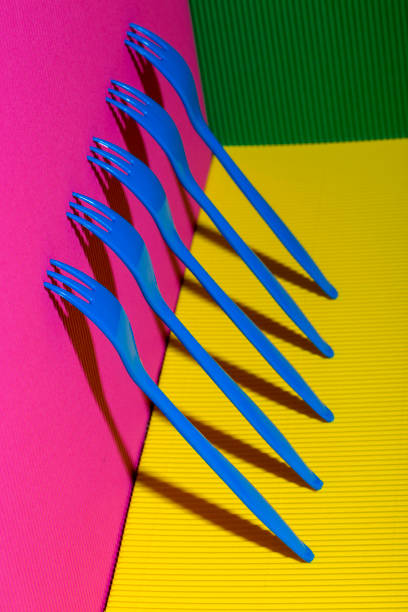 istock Abstract still life with blue forks on a colored background 1401581390