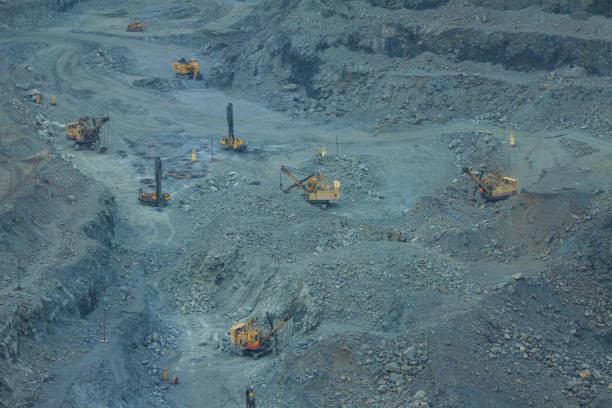 The work of large equipment for open-pit mining of iron ore.