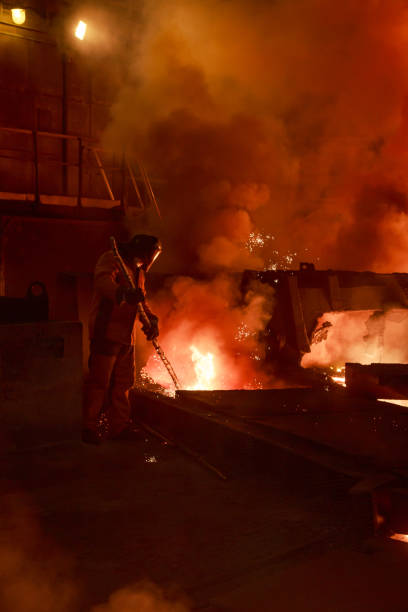 istock Steel foundry worker at blast furnace workshop. 1401582988