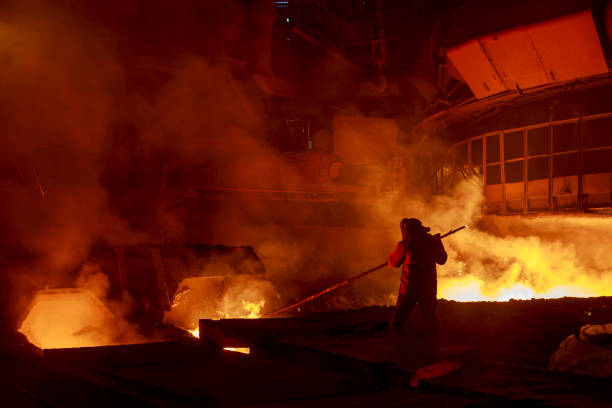 istock Steel foundry worker at blast furnace workshop. 1401583000