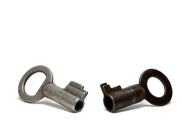 istock Closeup small old vintage keys white background 1401586868