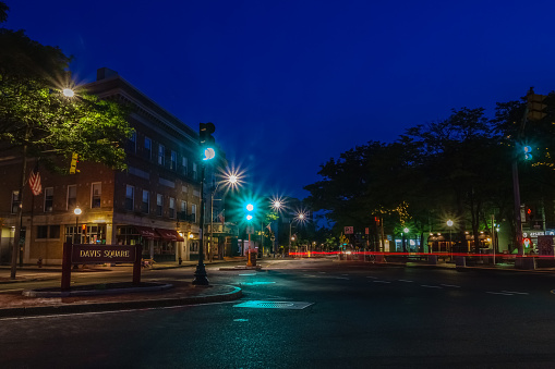 Somerville, MA, US-August 06, 2017: Trendy Davis Square in the evening.