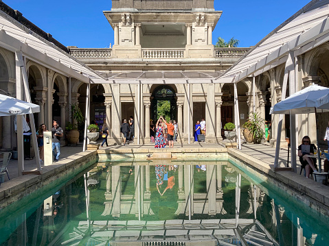 modern swimming pool among trees of luxury hotel
