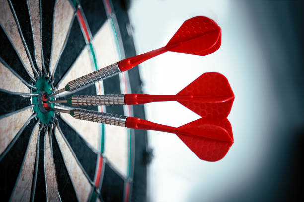 istock Darts hitting the bull's eye in a row. High accuracy concept. 1401588495