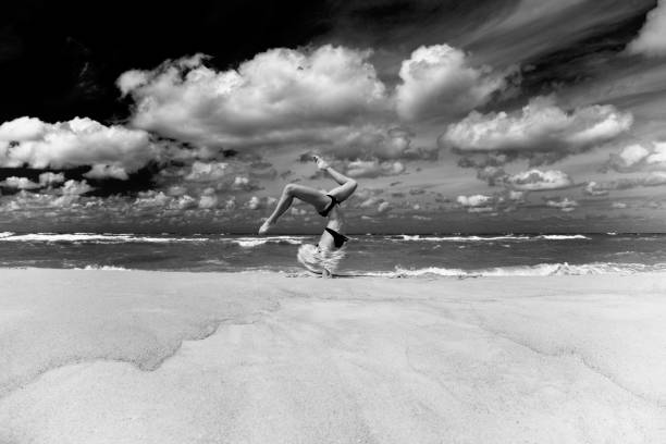 istock yoga on the sea beach 1401589664