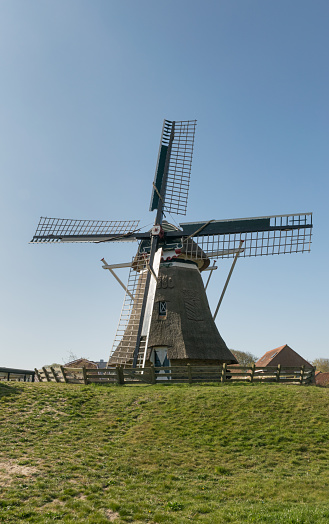 The Dutch windmill on the isle of Ameland on a beautiful summer day