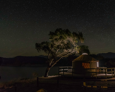 Exterior of a yurt at night under a starry sky, Lake Cachuma, Santa Barbara County, CA.