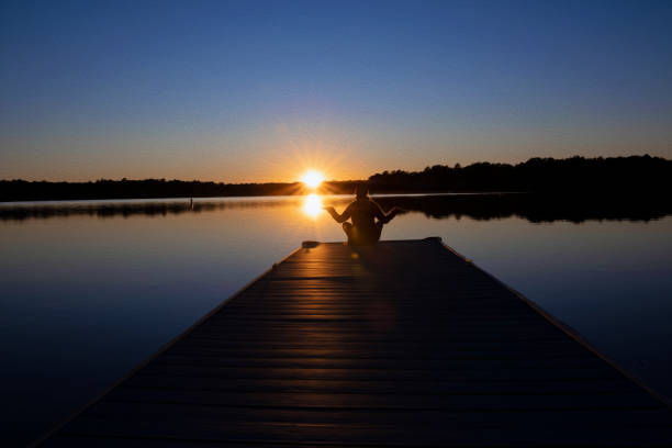 istock Individual Enjoying Sunset on Pier. 1401592388