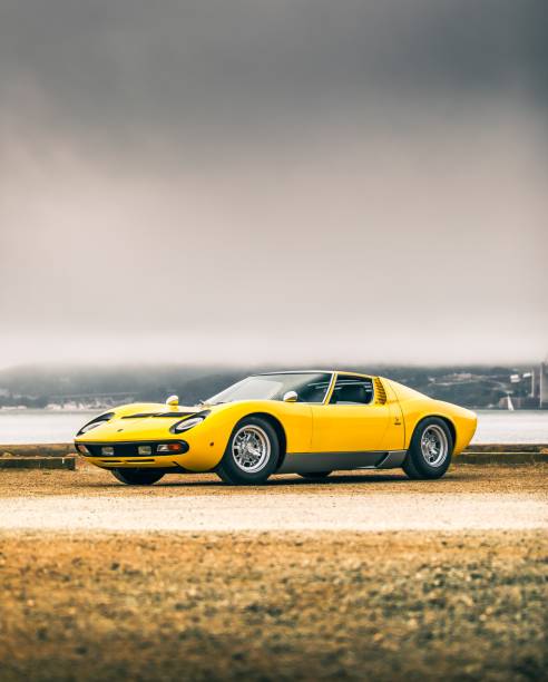 San Fran, CA, USA11/2/2021Yellow Lamborghini Miura parked sideways with fog overhead