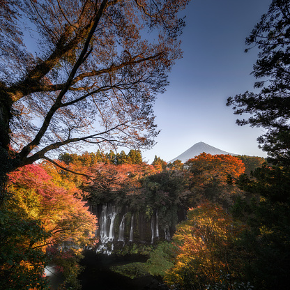 Photo of Mt Fuji with the foreground of Shiraito waterfall in autumn.