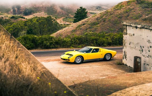 Yellow Lamborghini Miura San Fran, CA, USA
11/2/2021
Yellow Lamborghini Miura parked next to a stone building with hills in the background lamborghini miura stock pictures, royalty-free photos & images