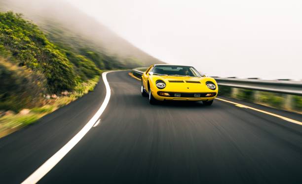 Yellow Lamborghini Miura San Fran, CA, USA
11/2/2021
Yellow Lamborghini Miura driving up a one-lane mountain road with fog in the background lamborghini miura stock pictures, royalty-free photos & images