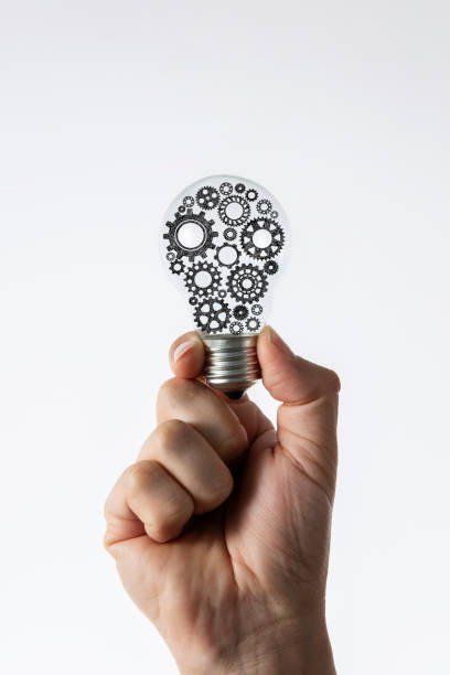 istock Hand Holding Light Bulb Made of Gears 1401594107