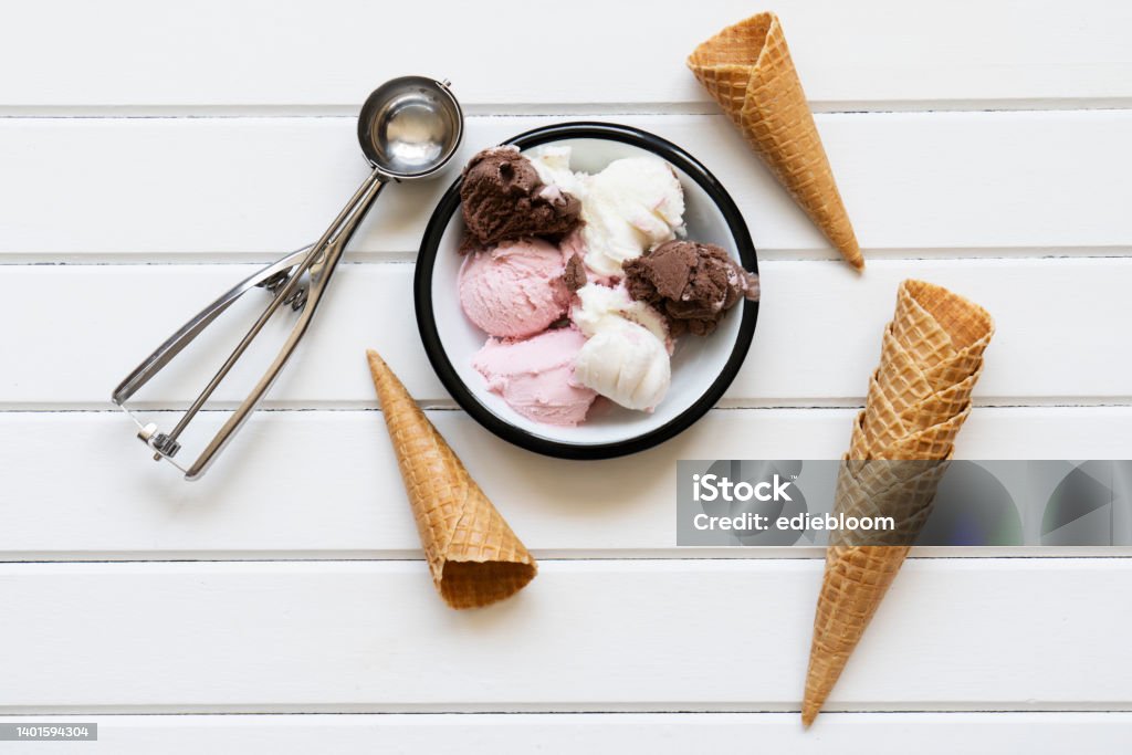 Ice cream Chocolate, strawberry and vanilla ice cream in a bowl on wooden table Ice Cream Stock Photo