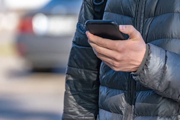 istock close-up of a man's hands with a smartphone connected to a wireless network online - technology, social network, communication concept 1401595132