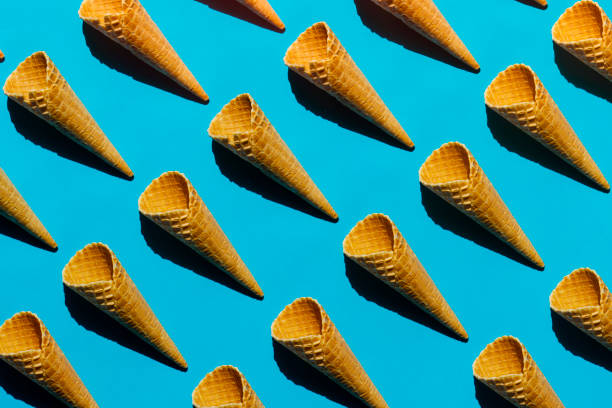 Ice cream waffle cones repetitive pattern on blue background