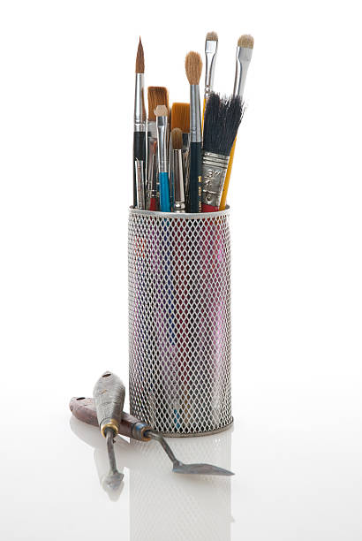 istock Paintbrushes in a metal mesh holder 140159761