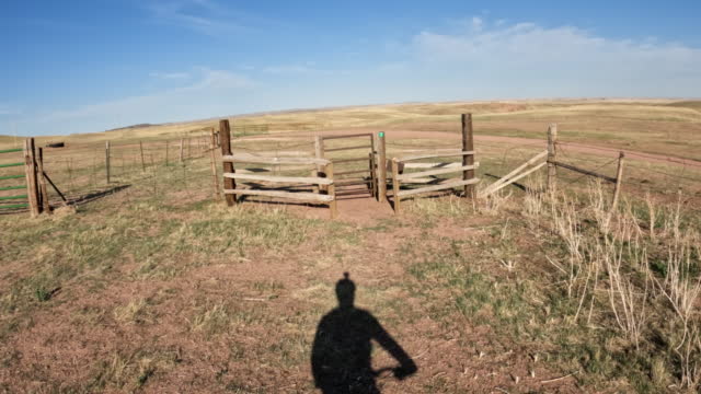 First person POV with cyclist shadow from riding a fat mountain bike on a trail in Colorado