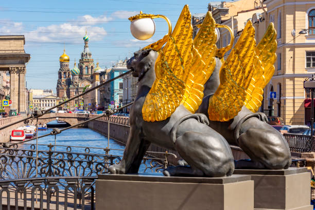 Bank bridge with golden-winged griffons over Griboyedov canal, Saint Petersburg, Russia stock photo