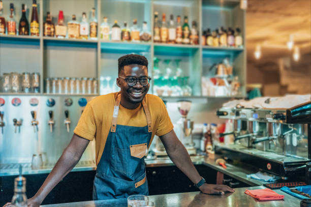istock Portrait of happy bartender 1401599120