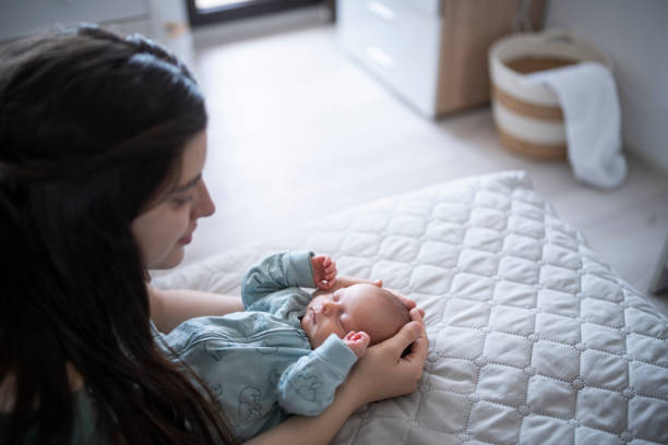 istock Mother embracing her newborn son. 1401599434