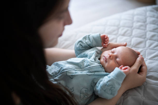 istock Mother embracing her newborn son. 1401599440