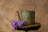 istock Vintage still life with teapot and flowers, lilac 1401600457