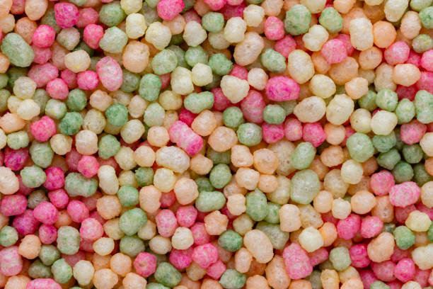 istock Thousands sprinkles tiny sugar beads for decorating cakes and desserts background. 1401600491