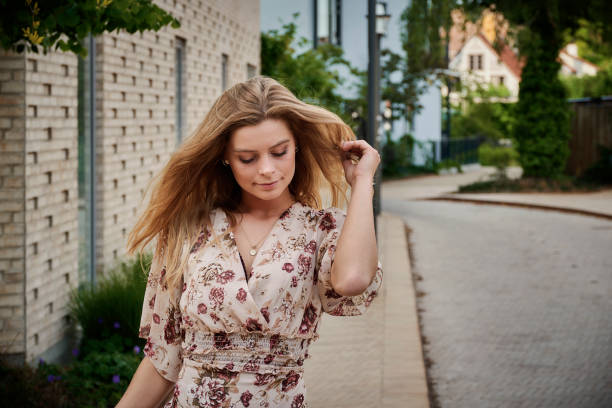 istock Young model outdoors in summer dress 1401600595
