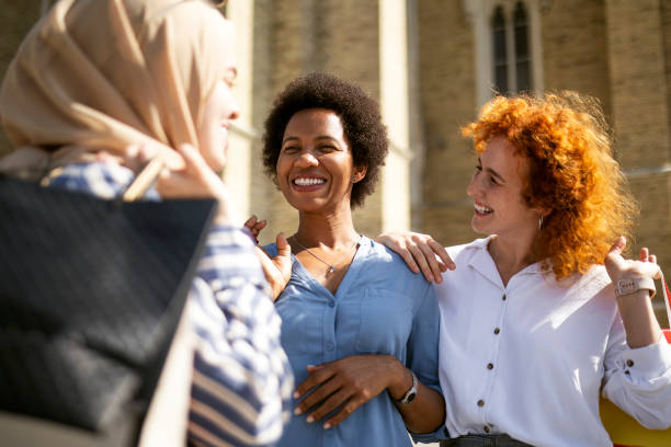 istock Group of three multiethnic friends in shopping 1401601168