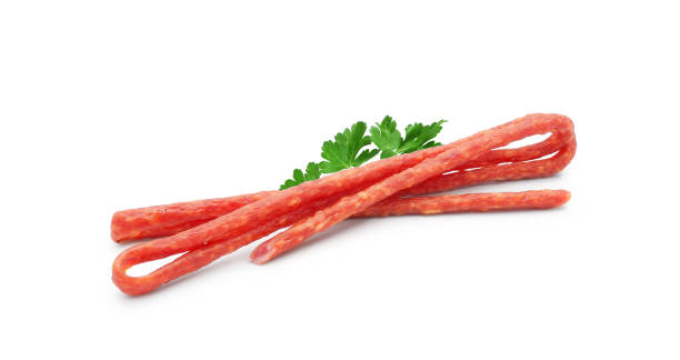 istock Kabanos - thin, dry Polish sausages, isolated on white 1401602647