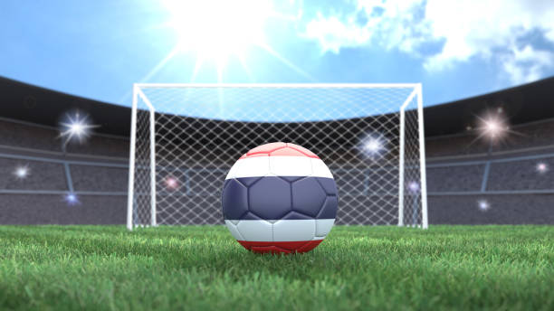 Soccer ball in flag colors on a bright sunny stadium background. Thailand. Soccer ball in flag colors on a bright sunny stadium background. Thailand. 3D image thailand flag round stock pictures, royalty-free photos & images