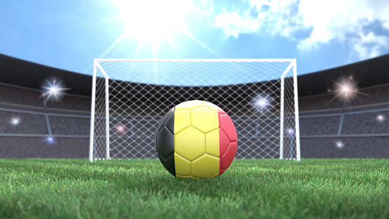 Soccer ball in flag colors on a bright sunny stadium background. Belgium. 3D image