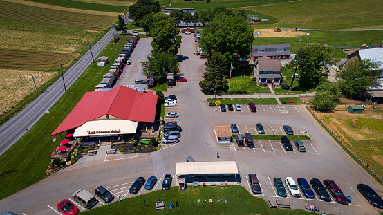 Ronks, Pennsylvania, June 6, 2021 - Aerial View of a Caboose Motel by Railroad Tracks on a Sunny Summer Day