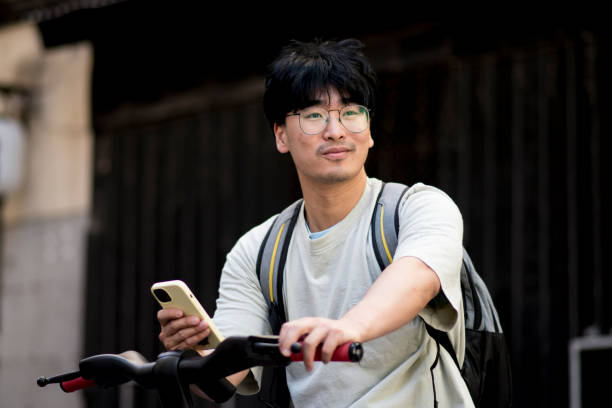 istock Asian boy riding an electric bike 1401605324