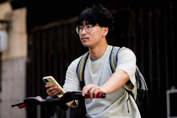 istock Asian boy riding an electric bike 1401605325