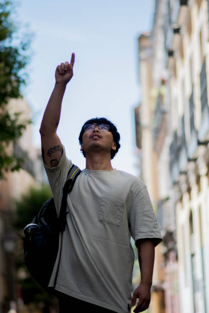 istock asian boy looking at the sky 1401605362