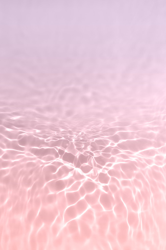 Serum or water texture close up. Light purple and pink gradient water background. Transparent beauty skincare sample. Cosmetic clear liquid smudge. Vertical banner with copy space.