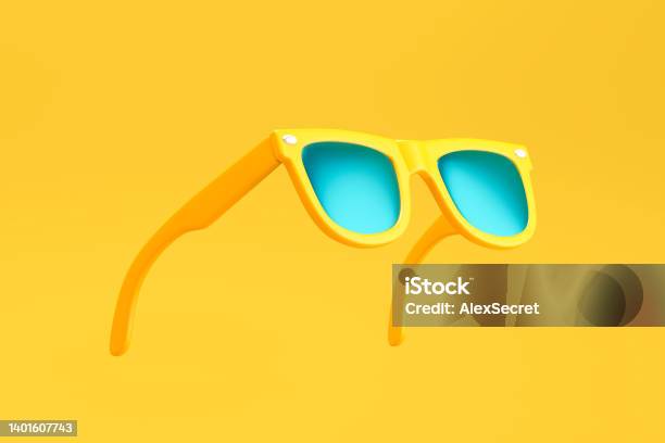 Yellow Sunglasses On Yellow Background Stock Photo - Download Image Now - Sunglasses, Three Dimensional, Eyeglasses